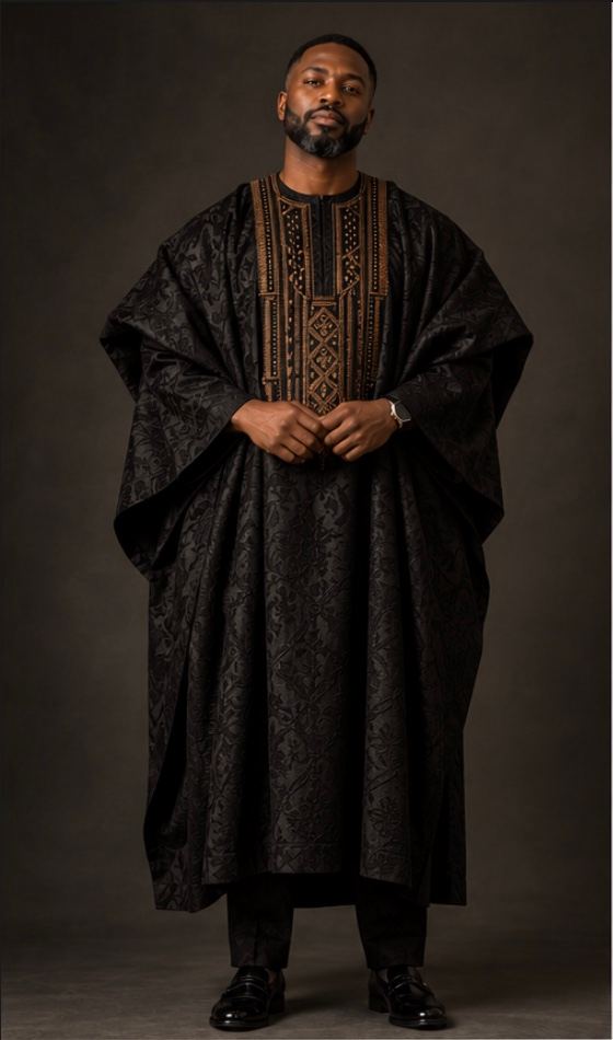 Black agbada with dense bronze threadwork across the chest, front view.