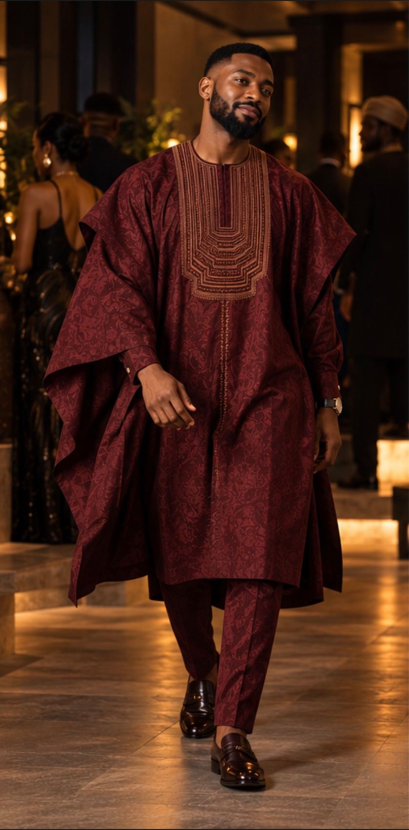 Oxblood agbada with bronze threadwork at the neckline, front view.
